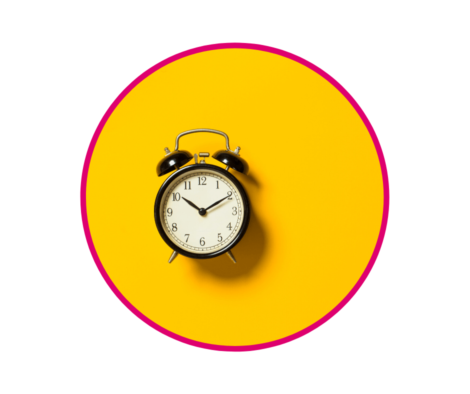 Alarm clock on yellow background